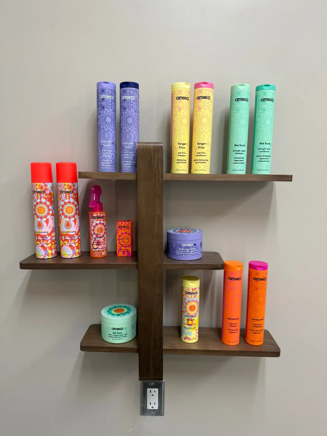 Wall shelf of colorful amika hair care products